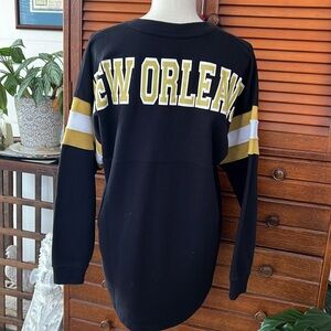 Long sleeved New Orleans jersey style sweater shirt.
